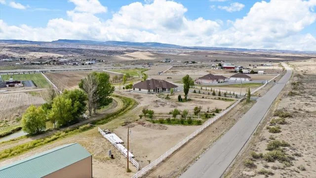 a view of a lake with a yard in front of it
