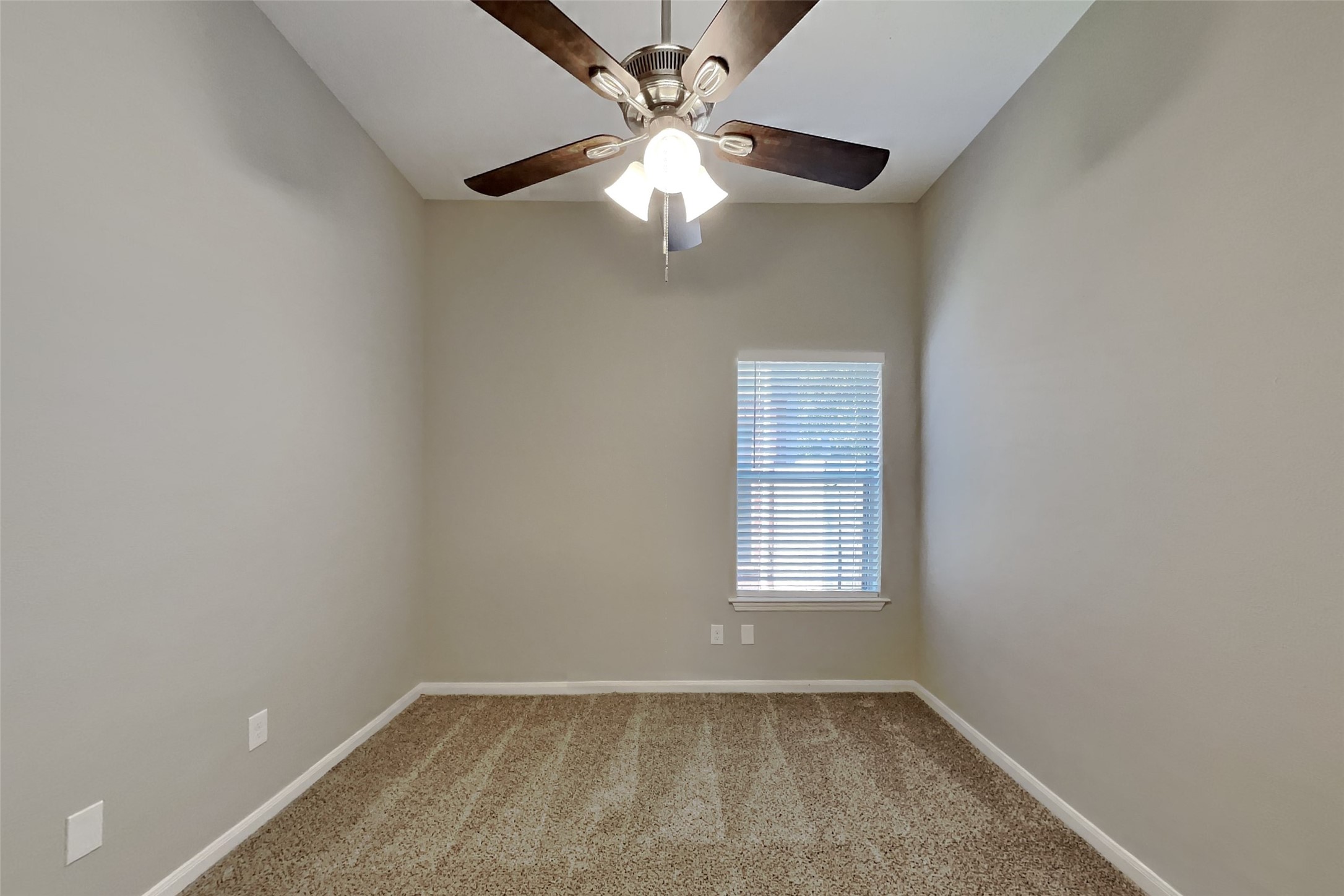 20022 Crossvine Trail Lane Cypress, TX 77433 - Photo 11 of 18 an empty room with windows and fan