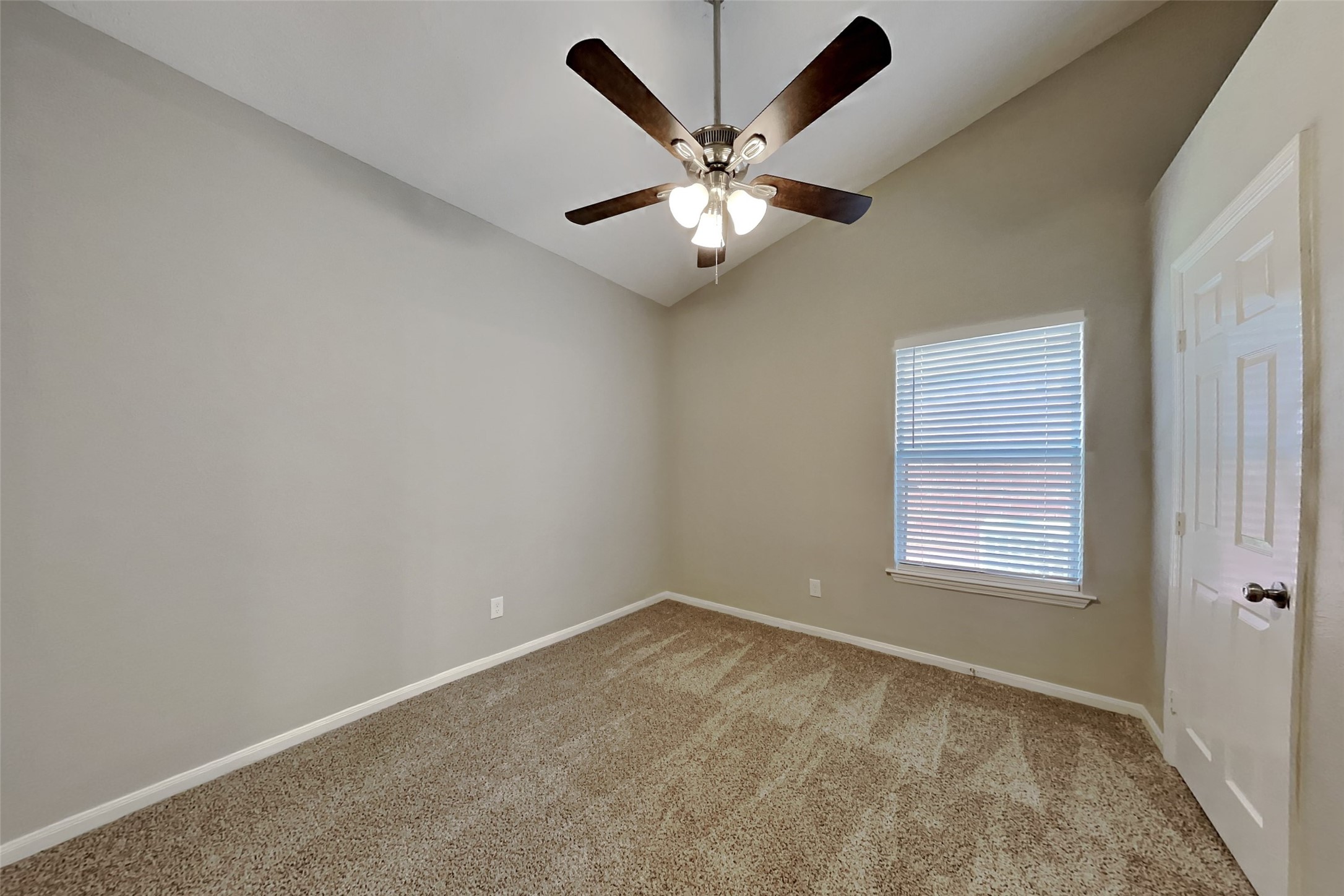 20022 Crossvine Trail Lane Cypress, TX 77433 - Photo 12 of 18 an empty room with window and ceiling fan