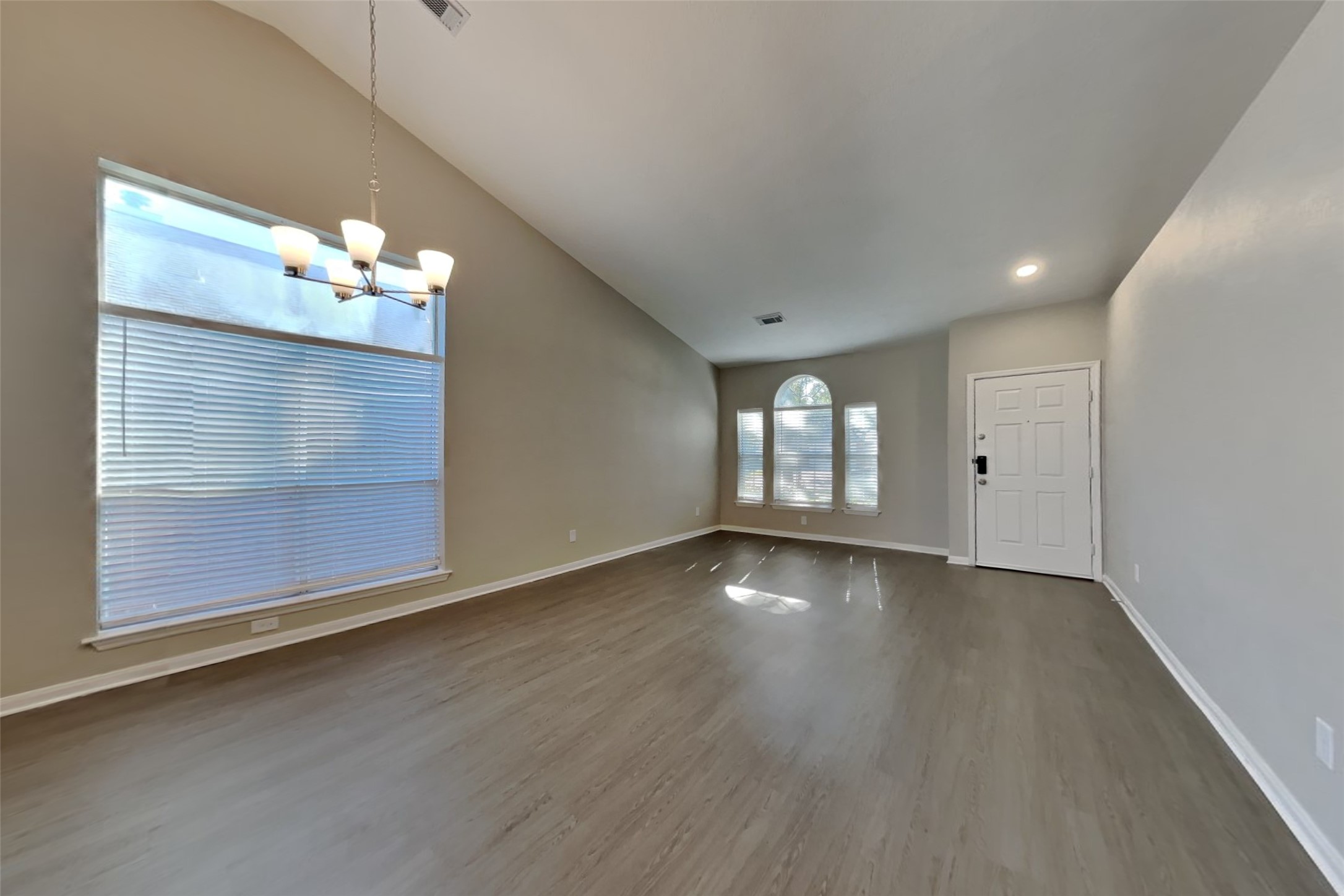 20022 Crossvine Trail Lane Cypress, TX 77433 - Photo 2 of 18 an empty room with wooden floor and windows
