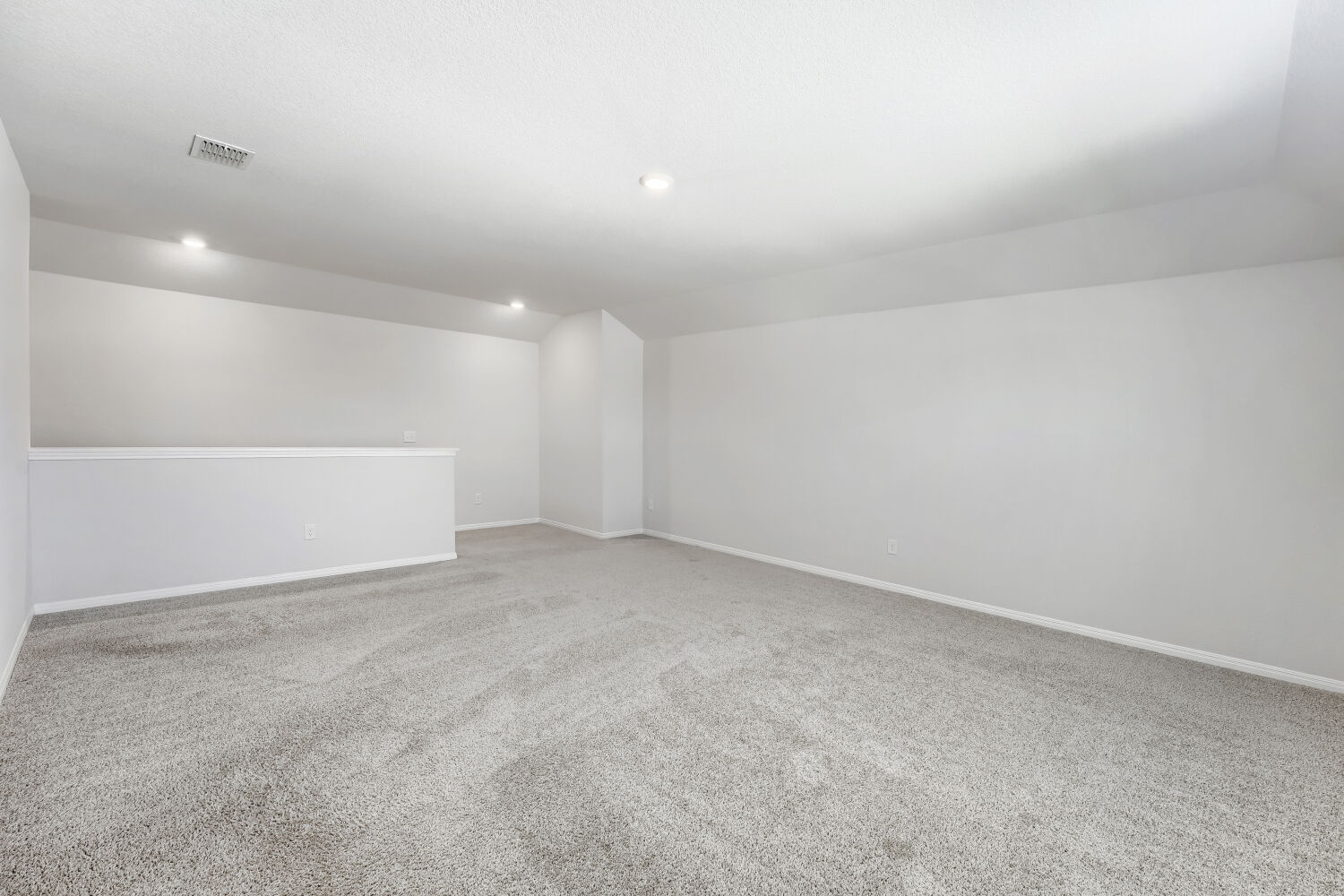 13507 Howser Trace Manor, TX 78653 - Photo 14 of 28 A spacious, naturally illuminated room featuring plush carpet and subtle recessed lighting.