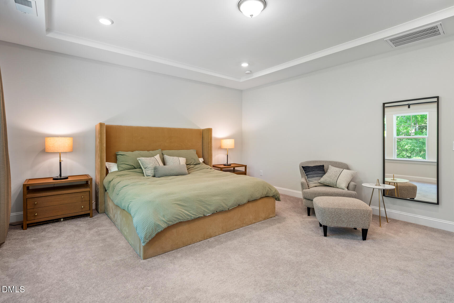2966 Rise And Shine Road Apex, NC 27502 - Photo 30 of 61 a spacious bedroom with a bed and a couch
