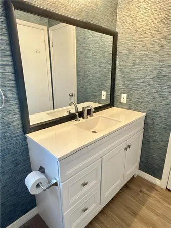 a bathroom with a sink and a mirror