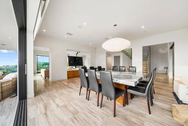 a view of a swimming pool with an outdoor seating