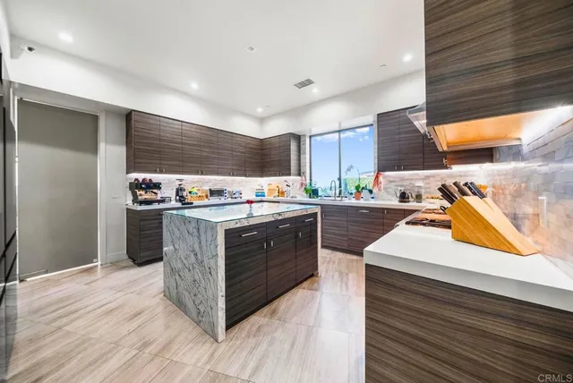 a bathroom with a double vanity sink toilet and shower