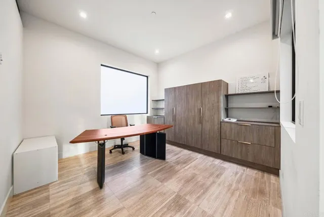 a view of a swimming pool with an outdoor seating and yard