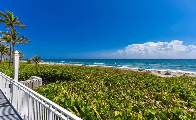 a view of a balcony with an ocean view