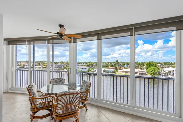 a view of a chair and table in the balcony