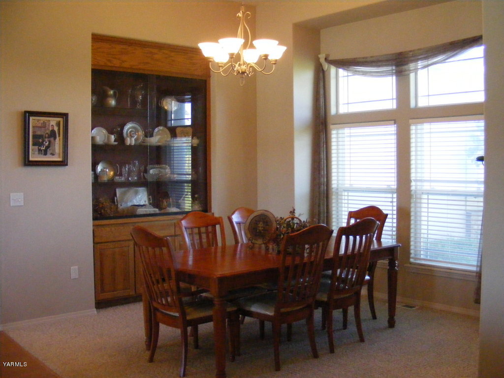 15012 Fisk Road Yakima, WA 98908 - Photo 7 of 23 a view of a dining room with furniture and window