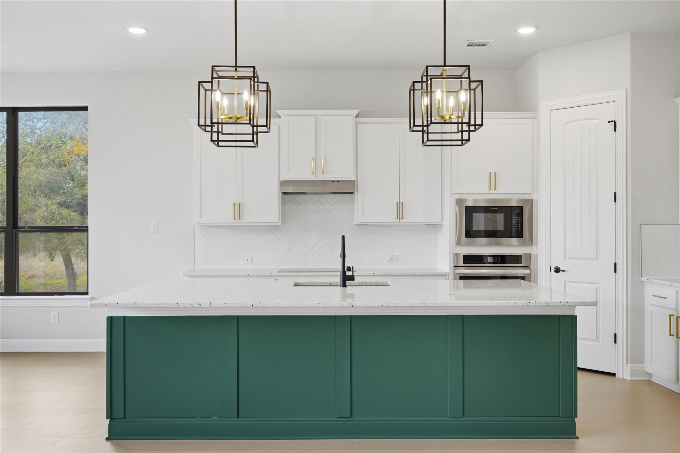 208 Tovas Secret Cove Georgetown, TX 78628 - Photo 13 of 40 a kitchen with cabinets and window