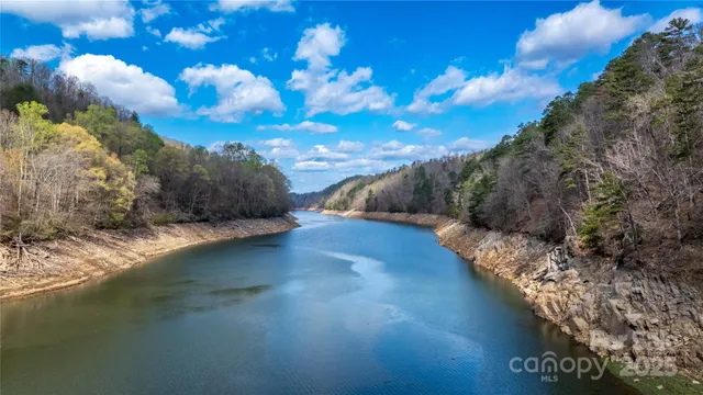 a view of a lake with mountains in background