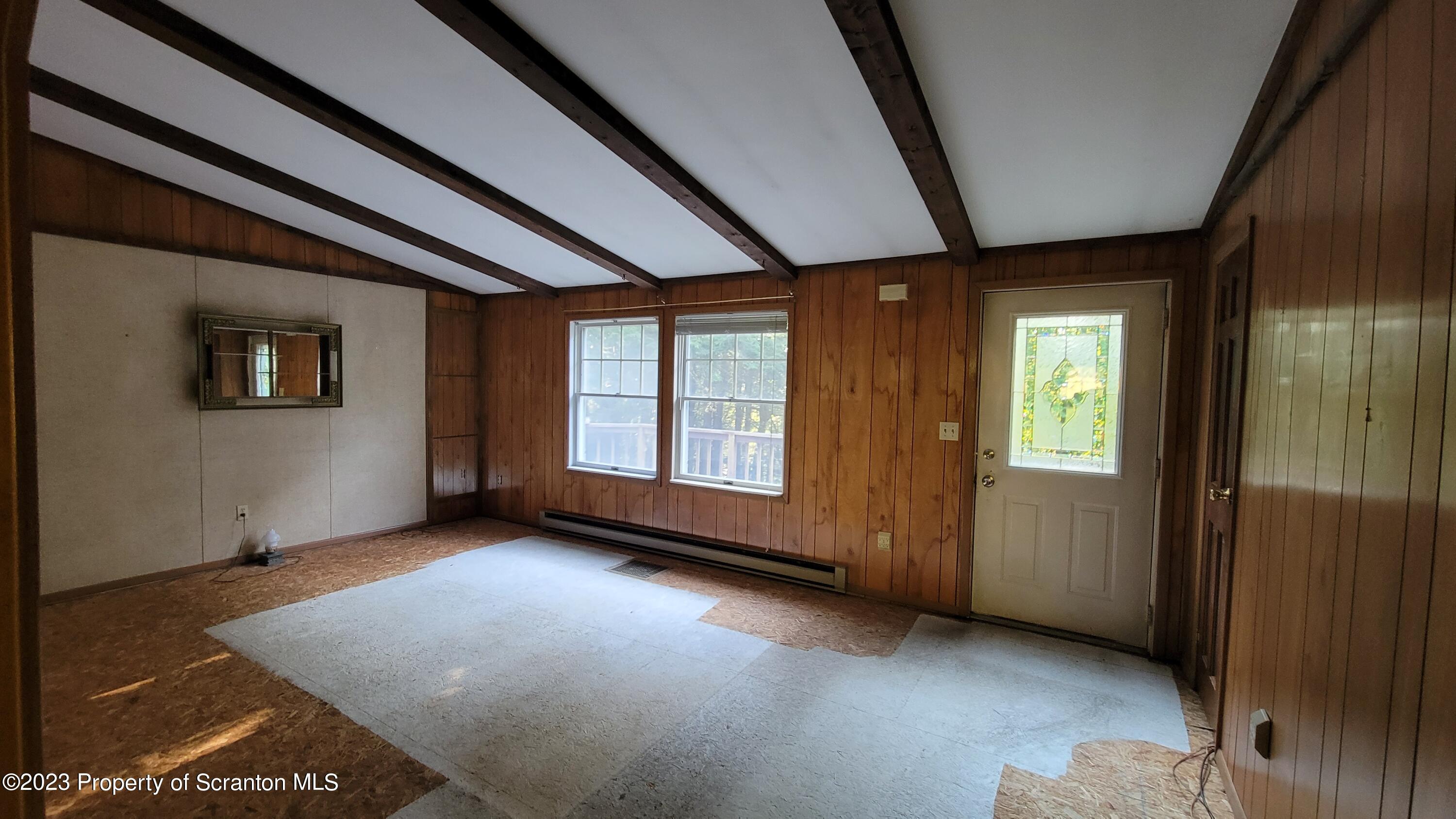1189 Hunsinger Road Hallstead, PA 18822 - Photo 11 of 11 an empty room with windows