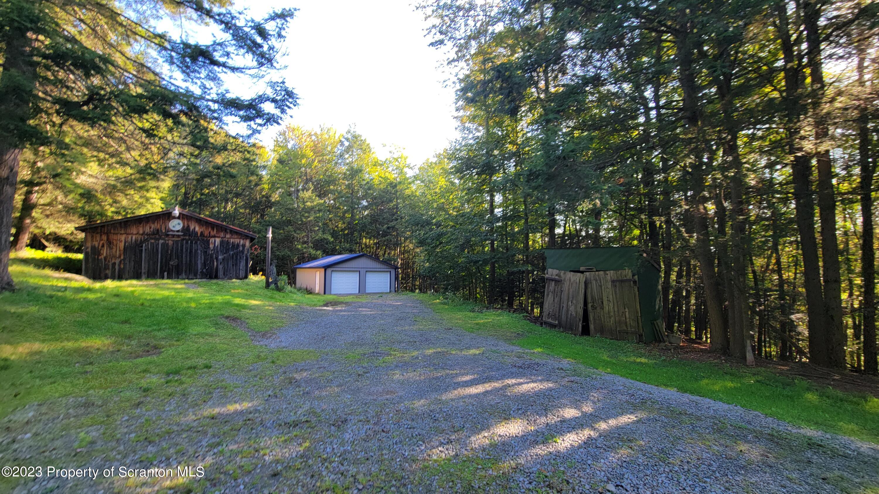 1189 Hunsinger Road Hallstead, PA 18822 - Photo 3 of 11 a backyard of a house with lots of green space