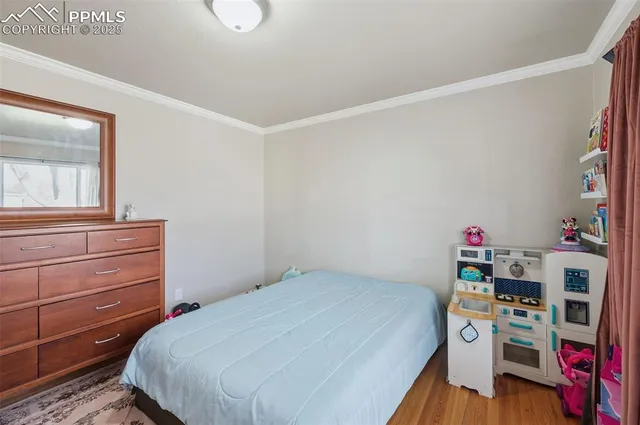 a bedroom with a bed and a book shelf