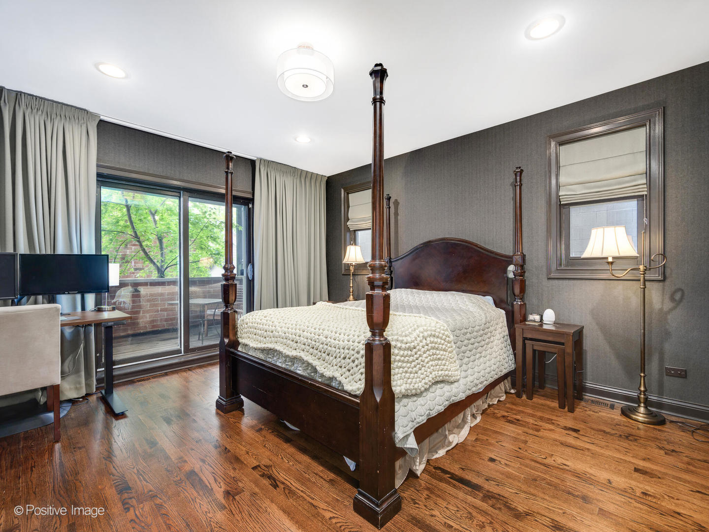 1745 West Roscoe Street, Unit 1 Chicago, IL 60657 - Photo 11 of 29 a bedroom with a bed window and a dresser