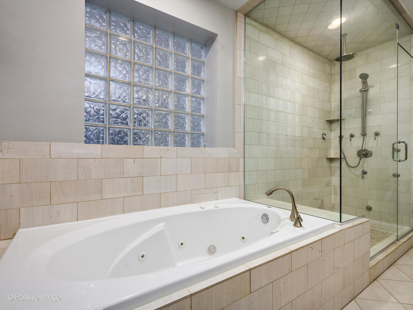 1745 West Roscoe Street, Unit 1 Chicago, IL 60657 - Photo 14 of 29 a bathroom with a bathtub and a shower