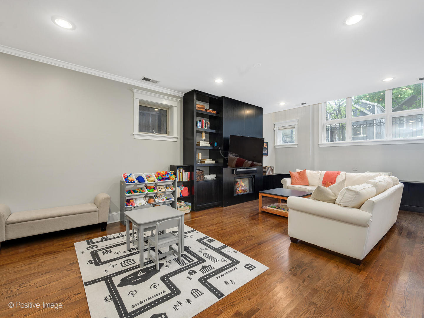 1745 West Roscoe Street, Unit 1 Chicago, IL 60657 - Photo 15 of 29 a living room with furniture and a wooden floor