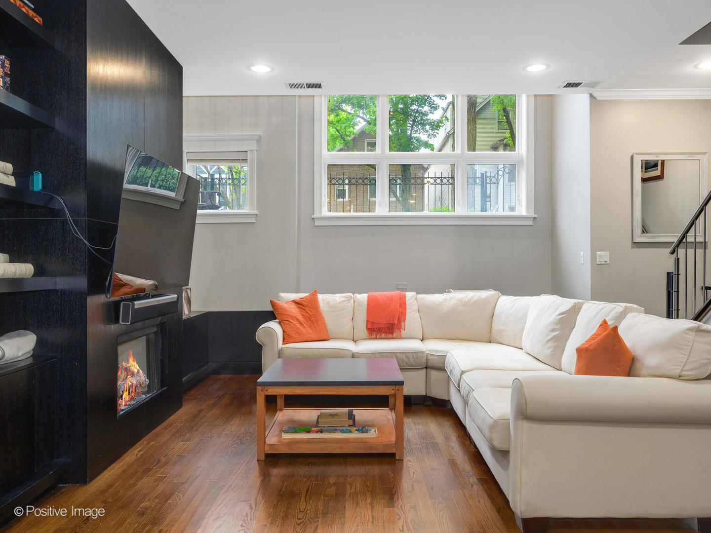 1745 West Roscoe Street, Unit 1 Chicago, IL 60657 - Photo 17 of 29 a living room with furniture and a flat screen tv