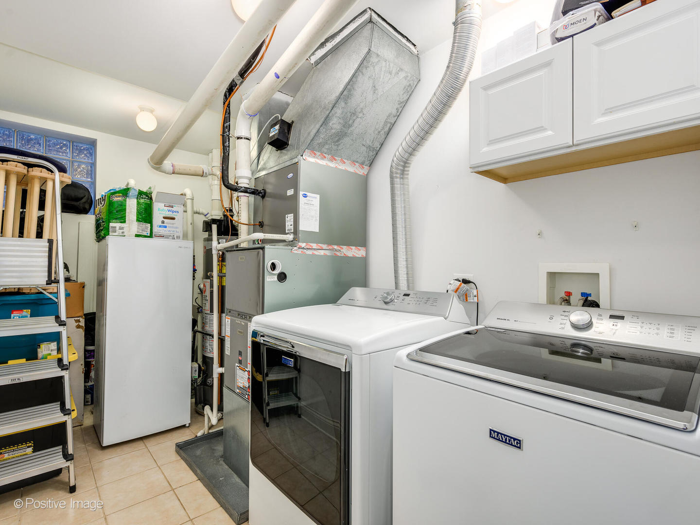 1745 West Roscoe Street, Unit 1 Chicago, IL 60657 - Photo 23 of 29 a utility room with dryer and washer