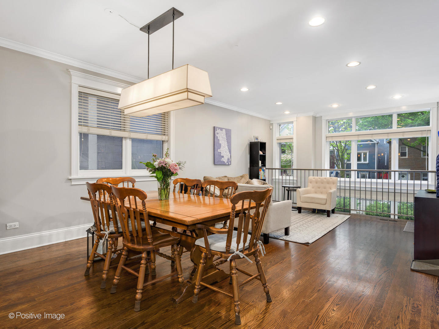 1745 West Roscoe Street, Unit 1 Chicago, IL 60657 - Photo 6 of 29 a view of a dining room with furniture window and wooden floor