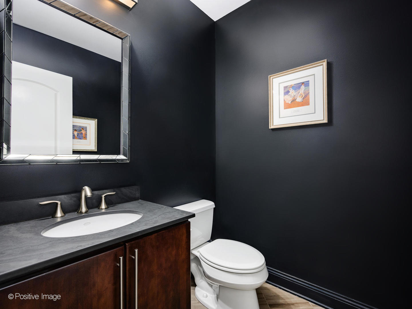 1745 West Roscoe Street, Unit 1 Chicago, IL 60657 - Photo 10 of 29 a bathroom with a granite countertop toilet sink and mirror