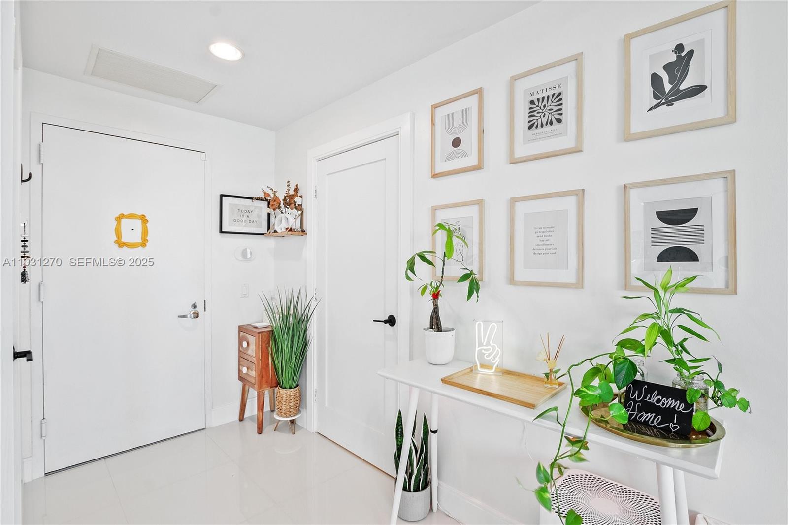 60 Southwest 13th Street, Unit 3603 Miami, FL 33130 - Photo 5 of 27 a living room with furniture and flowers