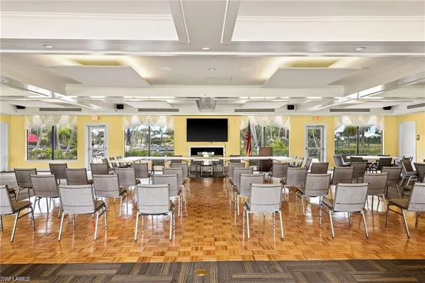 a living room with lots of furniture and a flat screen tv