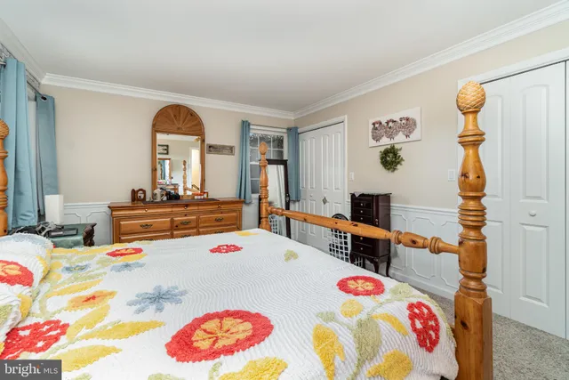 a bedroom with a bed and a table in it