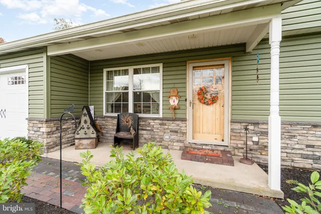 a view of a patio with table and chairs and potted plants