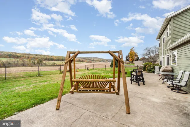 a view of outdoor space with garden and seating