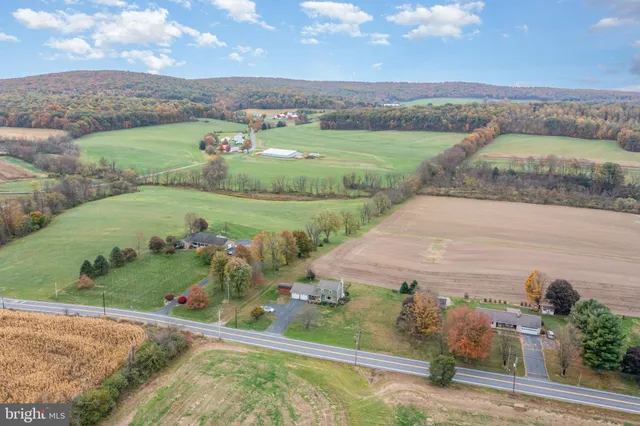an aerial view of a houses with outdoor space
