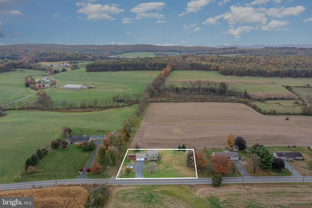 a view of a lake with a huge green field