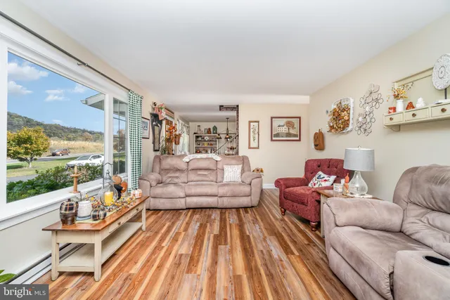 a living room with furniture and a large window