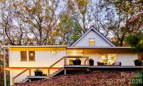 a view of a two chairs in the balcony