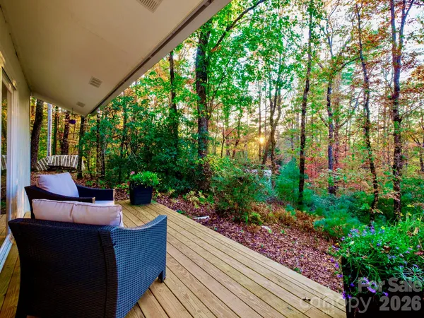 a view of backyard with swimming pool