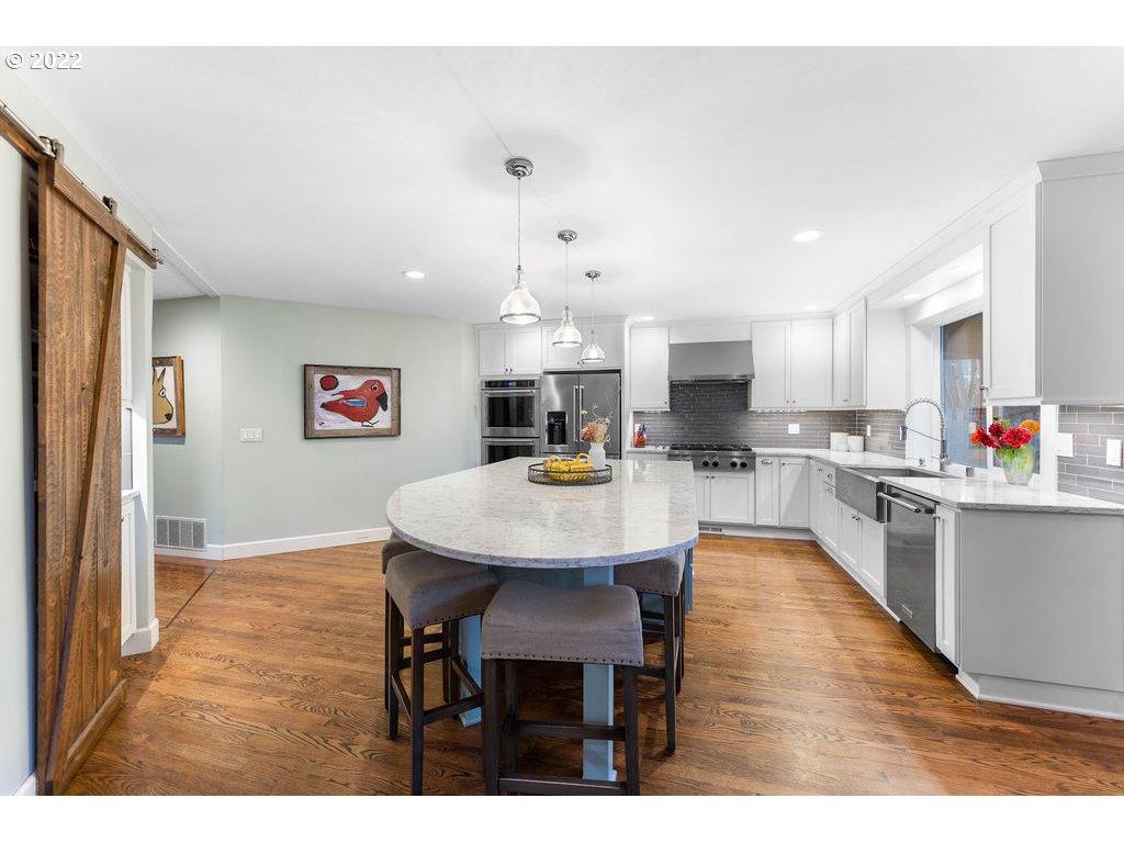 20010 Southeast 3rd Circle Camas, WA 98607 - Photo 12 of 28 a open kitchen with dining table and chairs