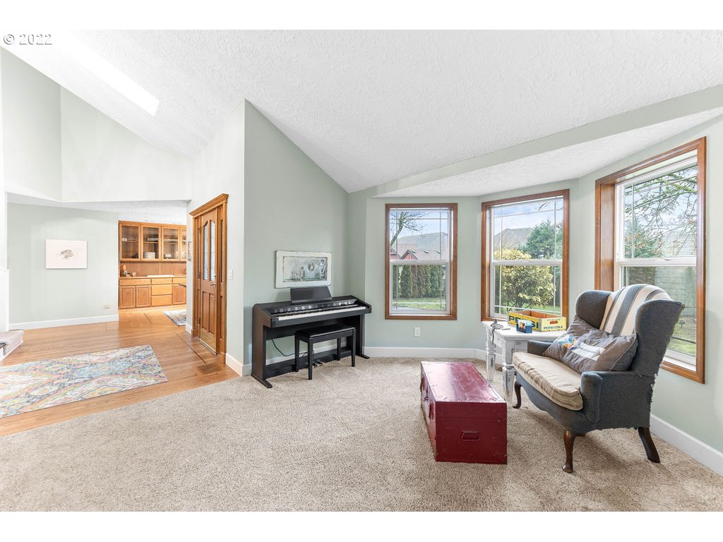 20010 Southeast 3rd Circle Camas, WA 98607 - Photo 18 of 28 a living room with furniture and a floor to ceiling window