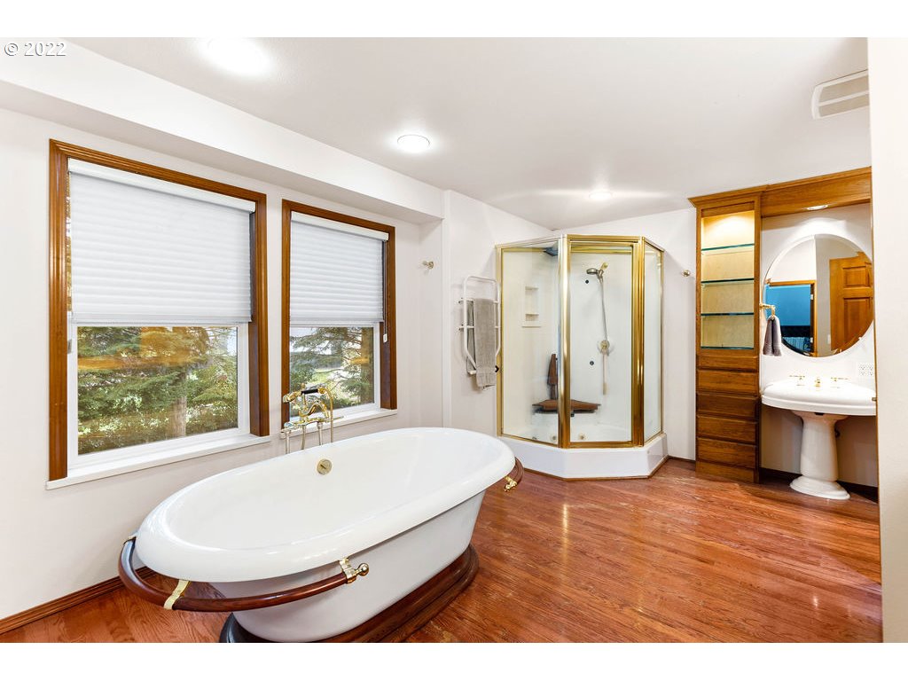 20010 Southeast 3rd Circle Camas, WA 98607 - Photo 23 of 28 a spacious bedroom with a large window and a wooden floor