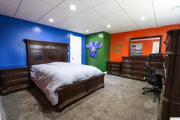 a bed room with a bed and a television