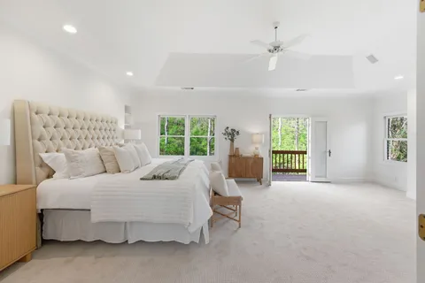 a bedroom with a bed and a couch