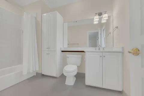 a bathroom with a toilet and a sink