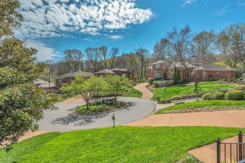 a view of a lake with houses in the back