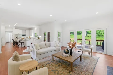 a living room with furniture and a table