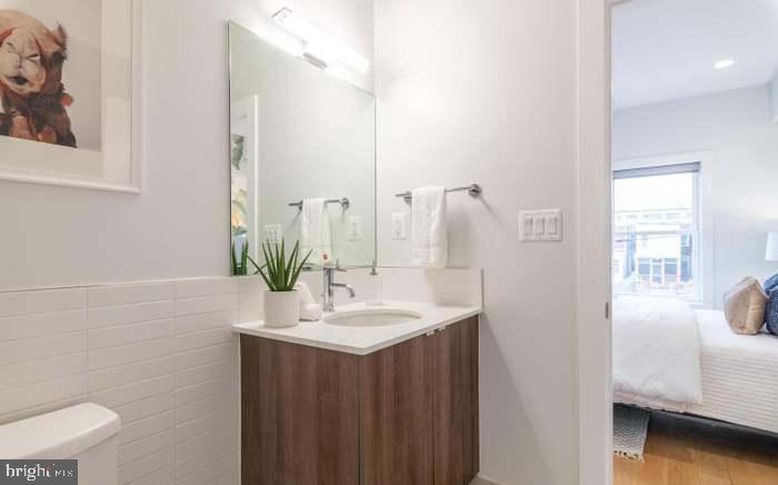 628 I Street Northeast, Unit 3 Washington, DC 20002 - Photo 20 of 32 a bathroom with a sink and a mirror