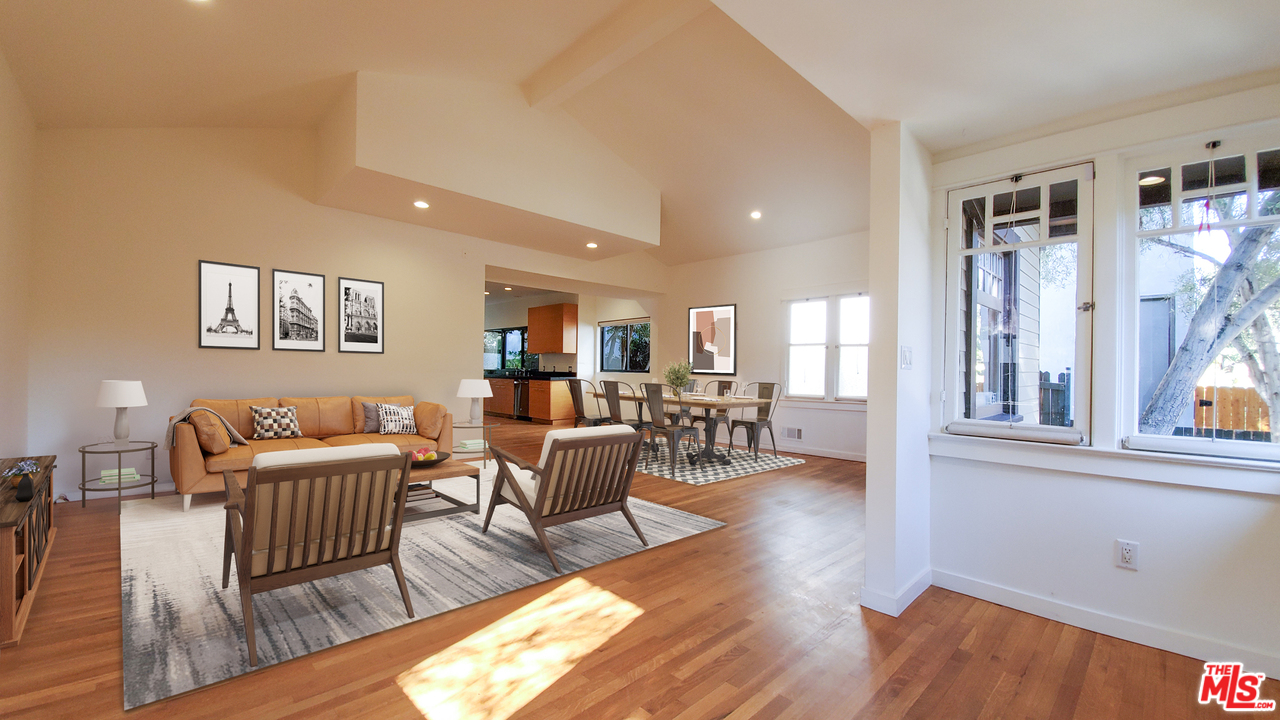 631 Palms Boulevard Venice, CA 90291 - Photo 2 of 23 a living room with furniture wooden floor and a large window