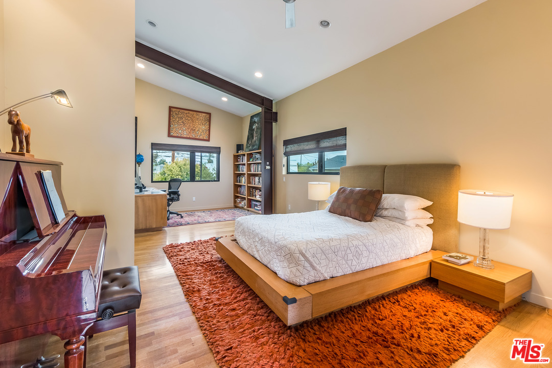 631 Palms Boulevard Venice, CA 90291 - Photo 13 of 23 a bedroom with a bed and wooden floor