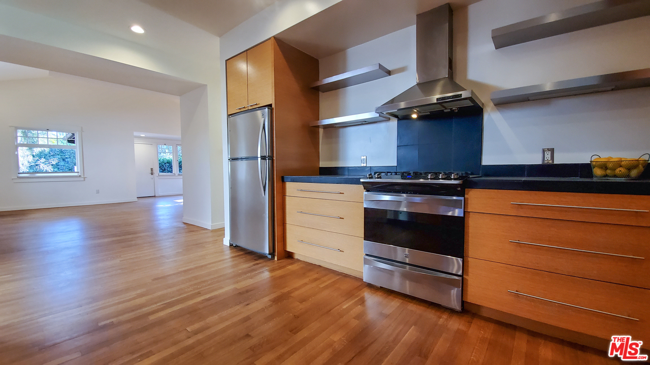 631 Palms Boulevard Venice, CA 90291 - Photo 9 of 23 a kitchen with a stove and wooden floor