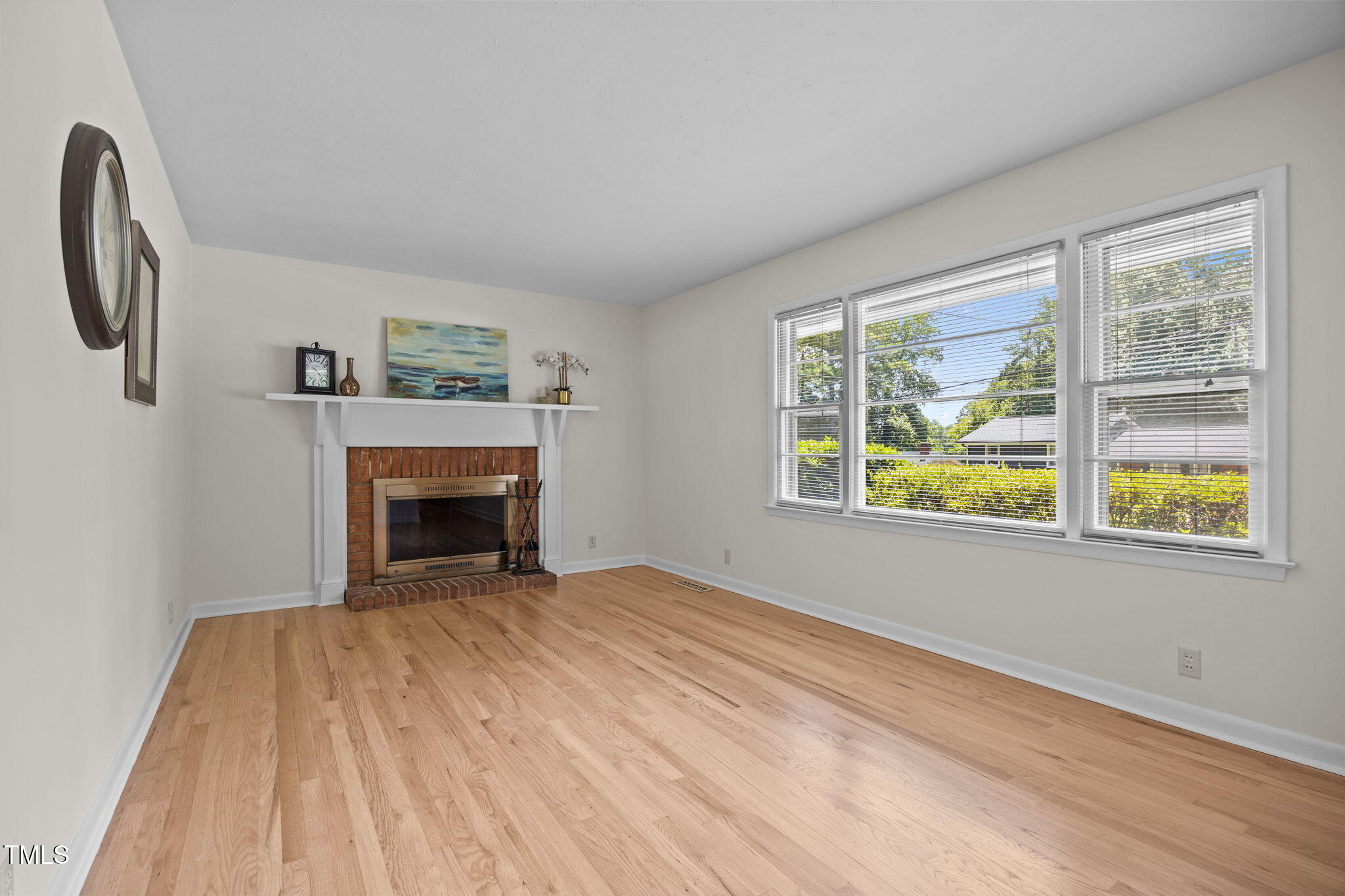 2809 Bardwell Road Raleigh, NC 27604 - Photo 4 of 19 a view of empty room with window and fireplace