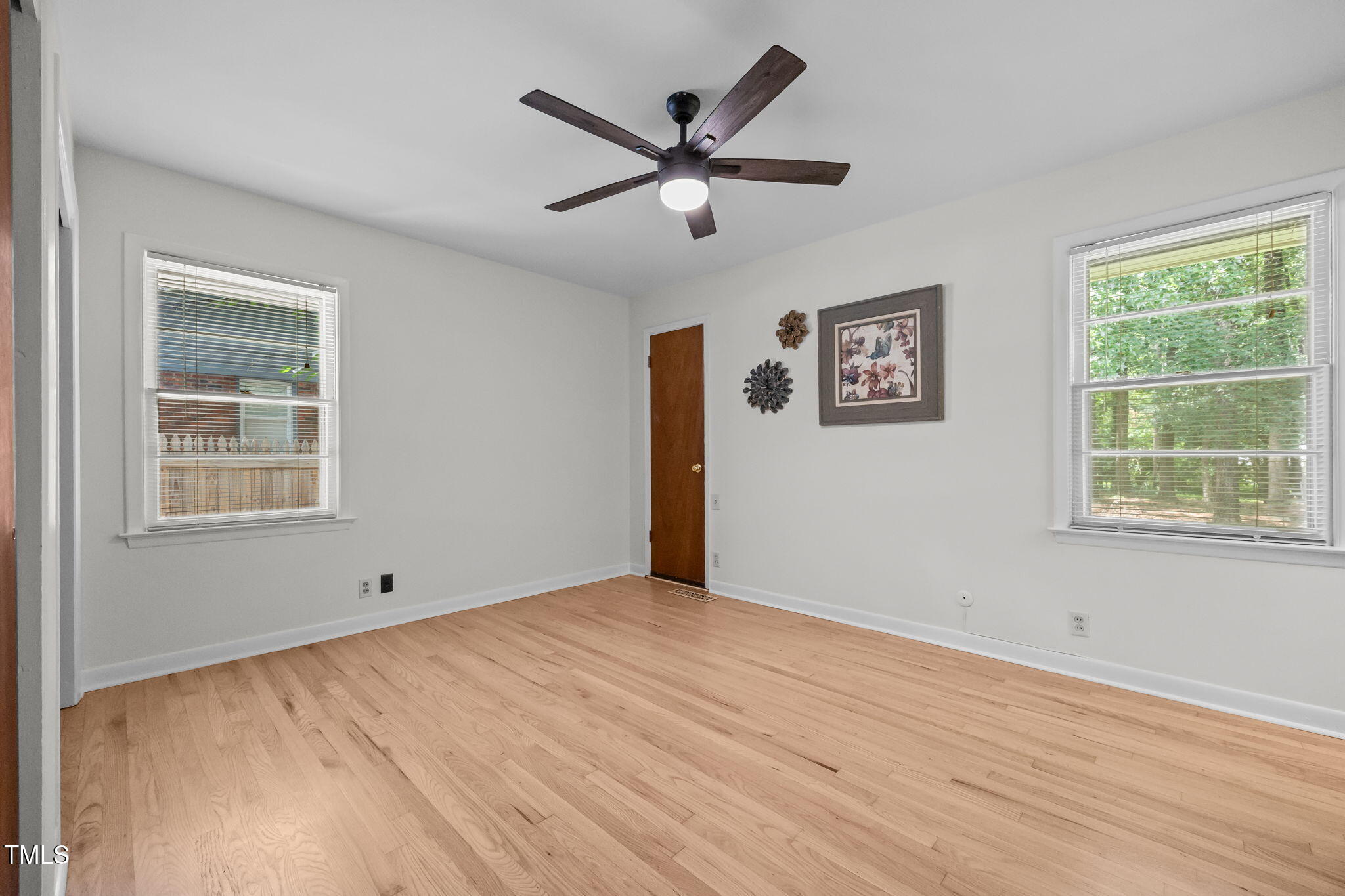 2809 Bardwell Road Raleigh, NC 27604 - Photo 9 of 19 a view of empty room with wooden floor and fan