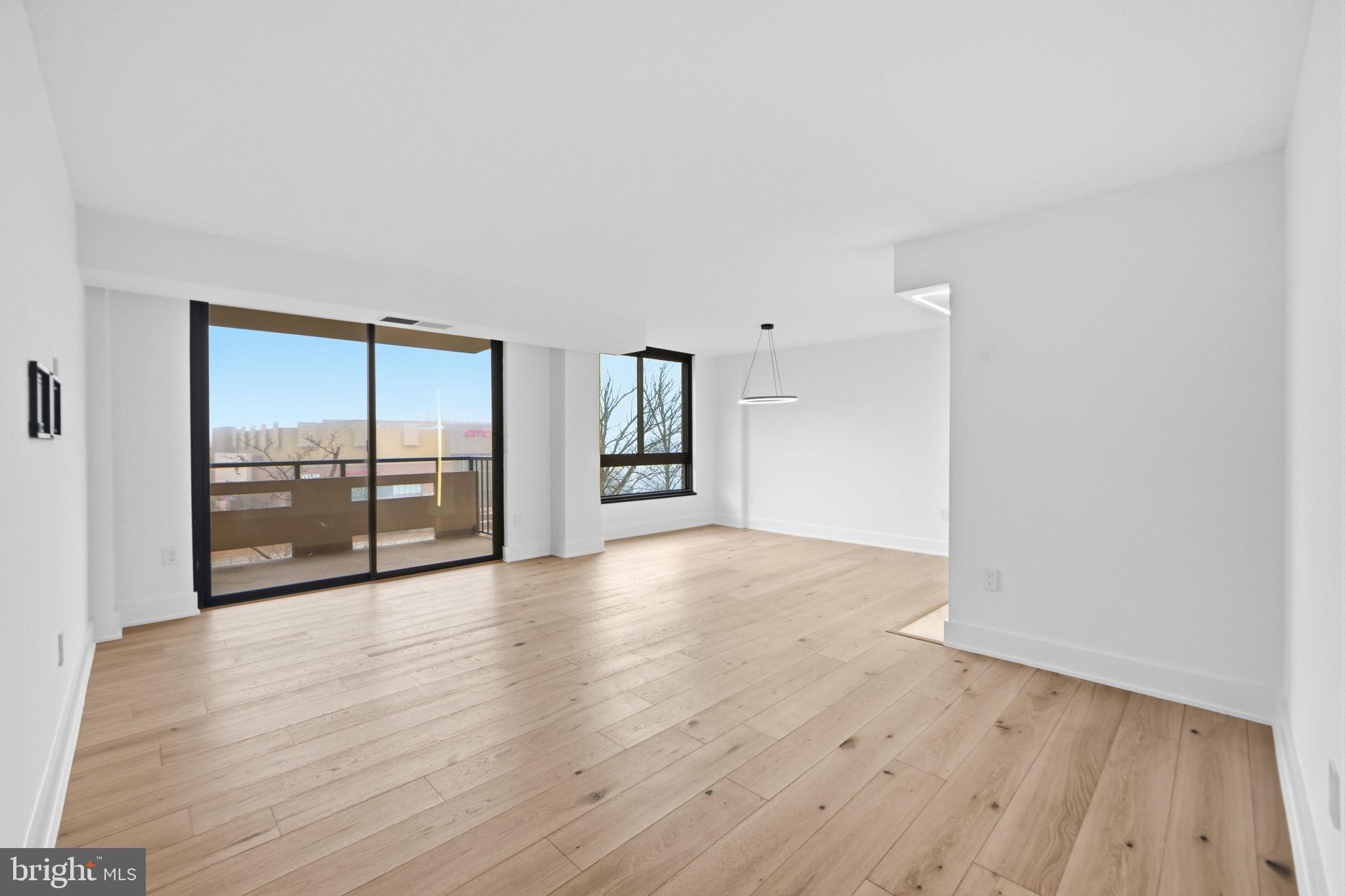 1808 Old Meadow Road, Unit 1201 McLean, VA 22102 - Photo 1 of 37 a view of an empty room with wooden floor and a window
